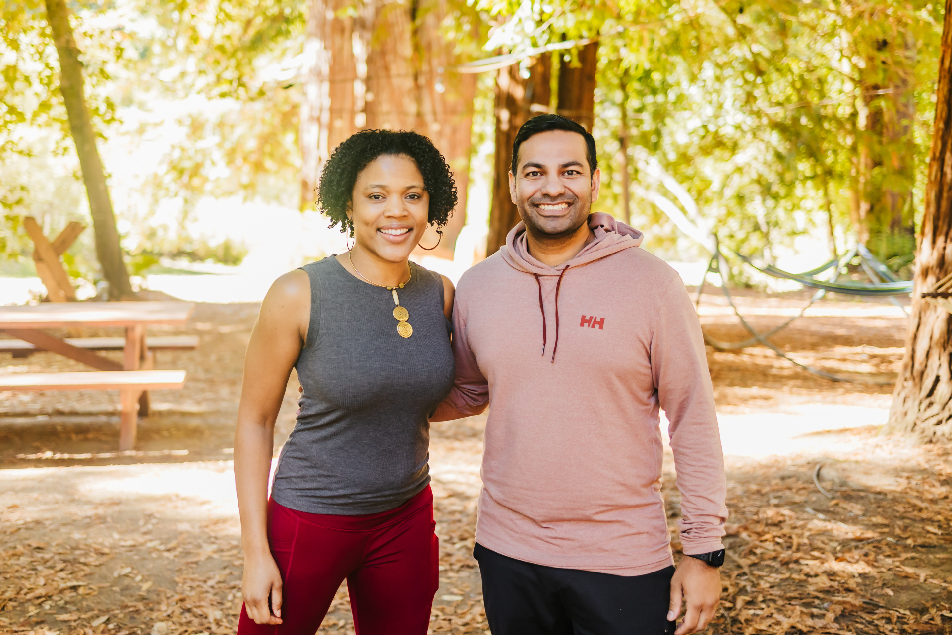 Gupta and his cofounder, Tanya Perkins, standing in the forest