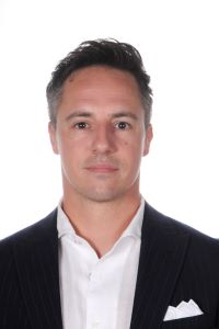 Photo of Michigan Ross Executive MBA student Fillippo Sparacino. He is wearing a black suti jacket with a white shirt underneath. He has dark hair.