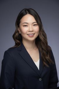 Photo of Kyla Chung Michigan Ross Online MBA student wearing a black suit jacket and a white shirt with long dark hair 