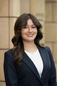 Photo of Samara Mehta Michigan Ross BBA student. She is wearing a black jacket with a white shirt underneath. She has long dark hair and she is smiling. 