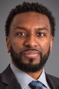 Photo of Michigan Ross Online MBA student Patrick Lee. He has dark hair and facial hair. He is smiling.