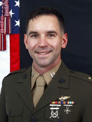 Man with short dark hair wearing a Marine Corps military uniform