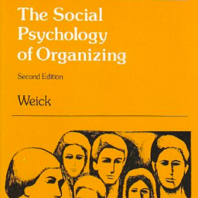 Yellow book cover with the title "The Psychology of Organizing" in white text. Illustration of human faces below title