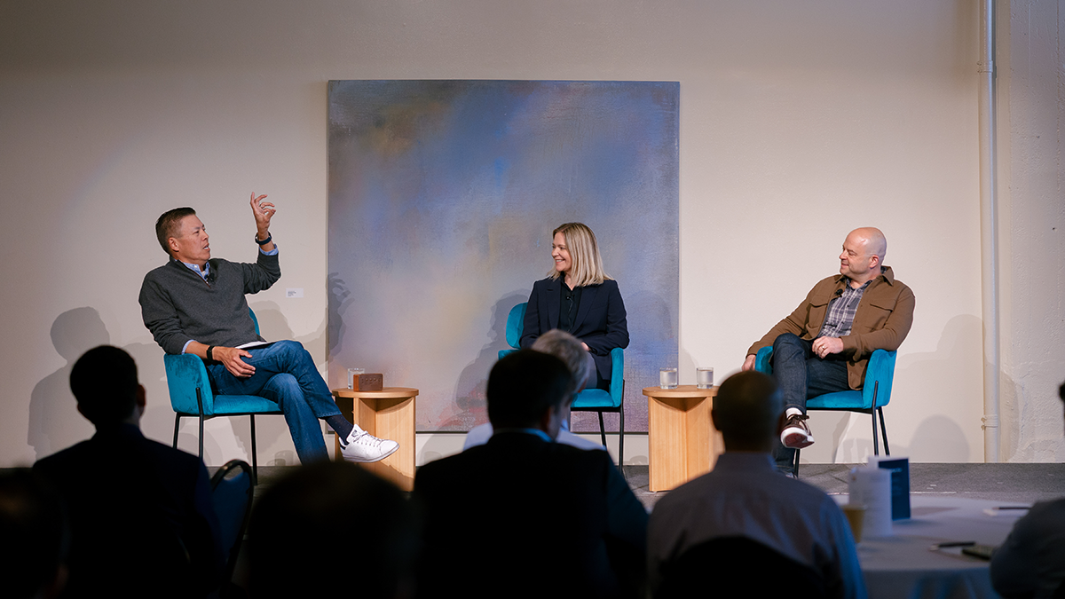 Three People on Stage Discussing the Founding of Inertia