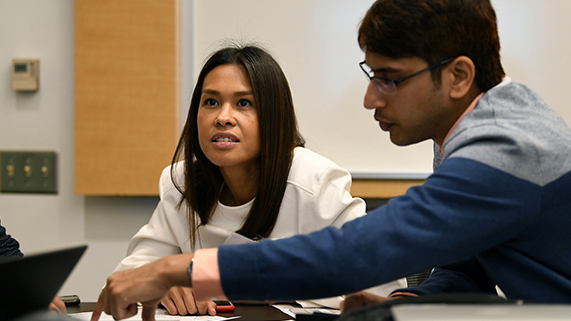 Part-time MBA students working together