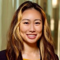 Jessica Liang smiles at the camera in this professional headshot.