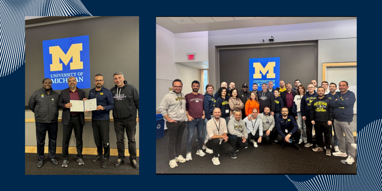 Two photos from a University of Michigan executive education program. On the left, a small group stands in front of a University of Michigan logo, with one participant holding a certificate. On the right, a larger group of participants pose together in a classroom, many wearing Michigan-branded apparel, smiling for a group photo.