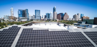 Photo of Austin, Texas, skyline framed by solar array
