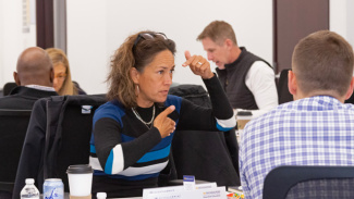 femlae executive in table discussion