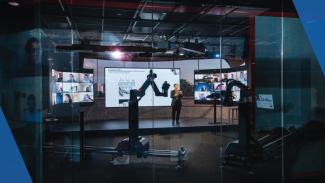 The Convatac Digital Studio is shown, with large screens and a robotic camera.