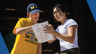 Two students look at a plan together