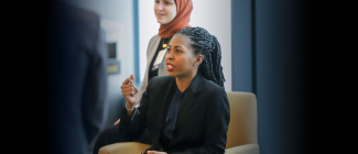 young woman speaking confidently to a group