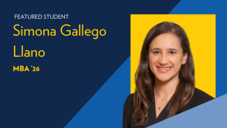 Text reads: Featured student Simona Gallego Llano, MBA '26. Portrait image of a woman with brown hair smiling, wearing a black jacket/coat in front of a maize and blue background.