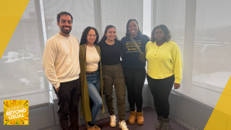 Five people standing together and smiling in a bright office with the Beyond Beyond Usual Podcast logo in the corner.