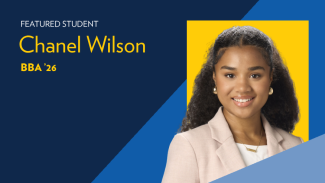 Text reads: Featured student Chanel Wilson, BBA '24. Picture of a woman with long curly brown hair and a pink blazer with white shirt. 