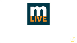 mLIVE logo with white "m" and orange "LIVE" on a dark background