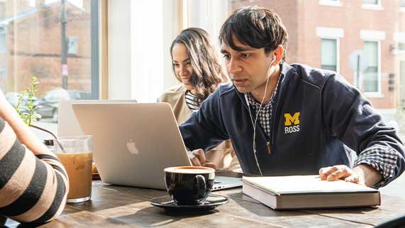 Students working on laptops in a coffeeshop