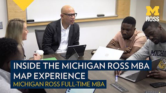 Video thumbnail titled "Inside the Michigan Ross MBA Map Experience" showing people seated at a table in discussion.