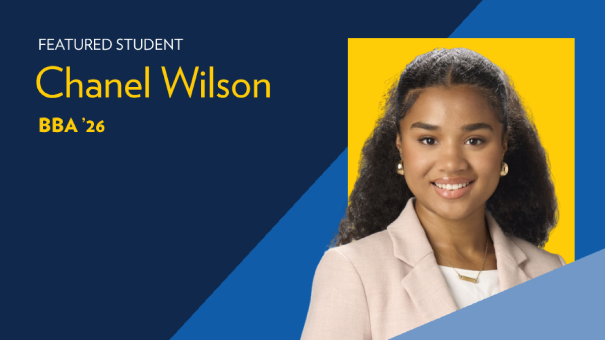 Text reads: Featured student Chanel Wilson, BBA '24. Picture of a woman with long curly brown hair and a pink blazer with white shirt. 