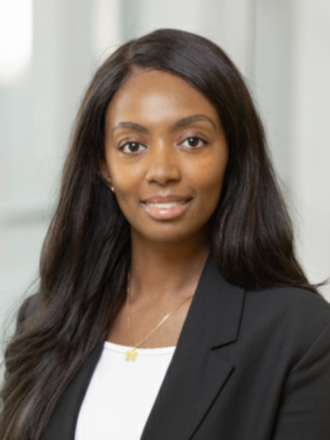 photo of african american women smiling wearing black blazer