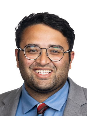 An image of Neil Parekh in a suit