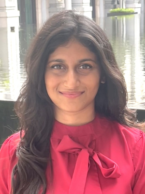 Portrait photo of an individual against a neutral background