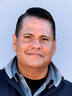 John Lobo wearing a dark jacket.