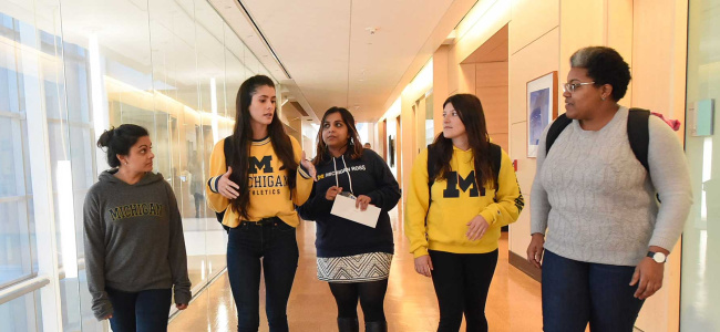 Students walking in the hall at the Ross building