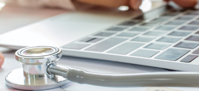 Healthcare worker at computer