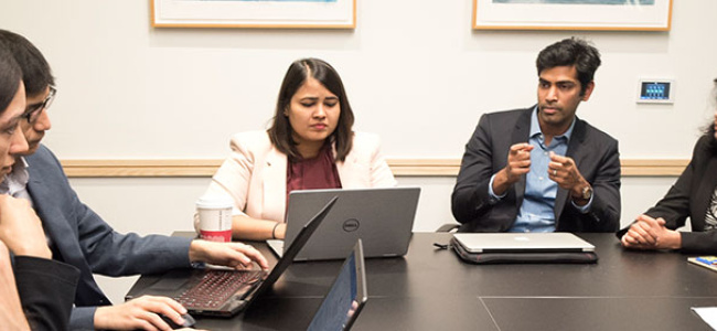 MSCM students at a table