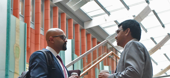 two men talking on the stairs