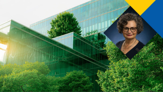 Photo of Professor Charlene Zietsma, sustainability expert. The background is an office building surrounded by greenery, symbolizing sustainable business practices.