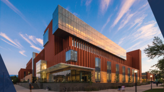 A photo of the Michigan Ross building at sunset.