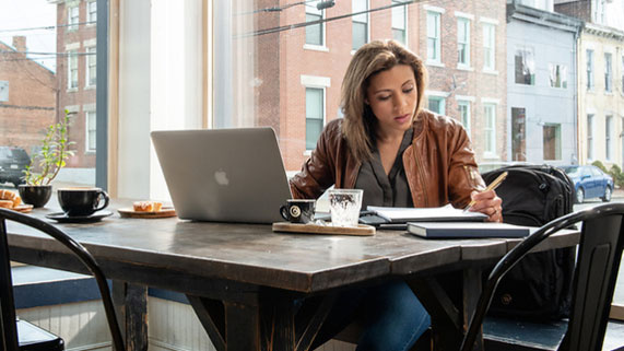 Student working at coffee shop