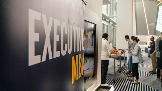 emba banner next to lunch being served